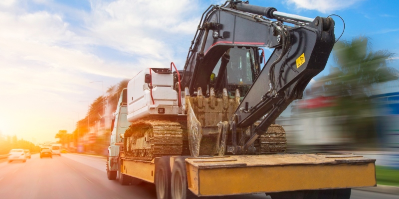 Heavy equipment transport for site preparation and cleanup